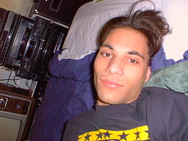 Picture of 'DJ' Brian from
       August 29, 1999 when he decided to take
       a lot of pictures of himself lying on
       his bed.